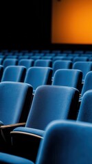 Naklejka premium Empty blue theater seats waiting for an audience to arrive.