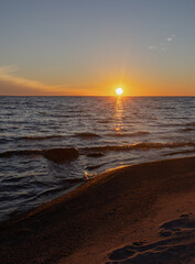 Orange sunset over choppy Georgian Bay near Midland Ontario in late summer