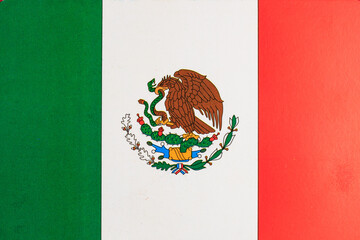 Mexican flag with eagle and snake emblem on green, white, and red stripes