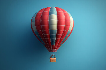 Fototapeta premium A red and blue hot air balloon floats against a blue sky