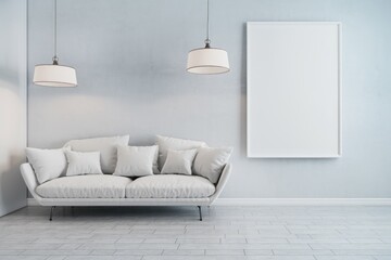Minimalist living room with white sofa  two pendant lights  and a blank canvas.