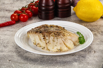 Baked cod fish fillet with spices