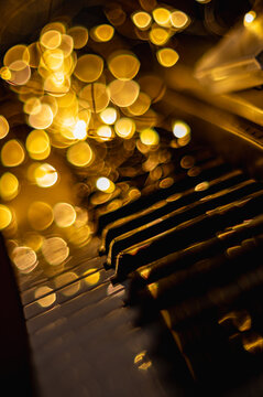 Softly blurred piano keys create a dreamy, atmospheric image with a shallow depth of field. Perfect for music-related projects or to evoke a sense of nostalgia and emotion.