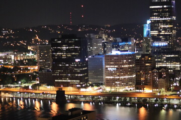 Fototapeta premium Birds eye view of the city skyline of downtown Pittsburgh, Pennsylvania at night.