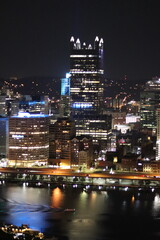 Fototapeta premium Birds eye view of the city skyline of downtown Pittsburgh, Pennsylvania at night.