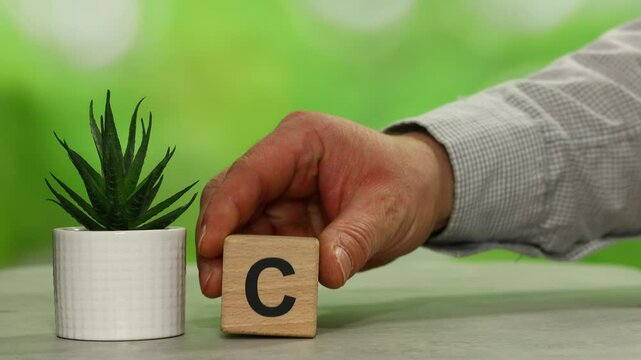 Wooden cubes form the symbol CCS (carbon capture storage) and CCU (carbon capture utilization). Environmental Business concept, Net zero action, Save energy, green energy, reduce carbon footprint