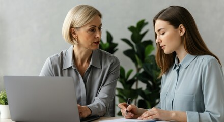 Obraz premium Woman is writing on a piece of paper