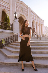beautiful slavic woman in elegant dress and accessories posing in antic style villa
