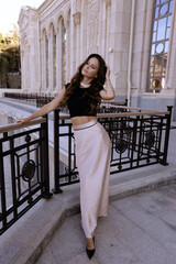 beautiful slavic woman in elegant dress and accessories posing in antic style villa