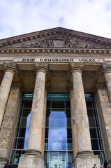 Reichstag building facade with inscription Dem Deutschen Volke showing neoclassical columns