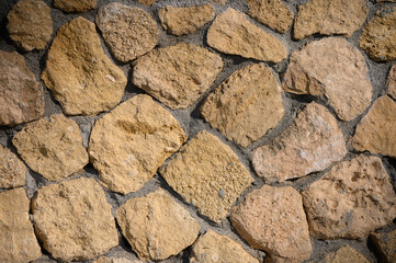 Discovering the beauty of rustic stone walls in a sunlit courtyard