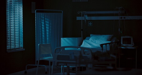 Dark, empty hospital room.