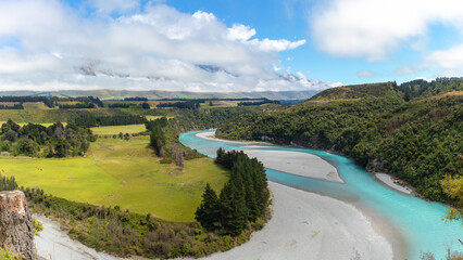 Blue water of Rakaia river running in canyon, summer landscape
