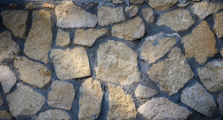 Natural stone wall showcasing rustic charm in soft afternoon light
