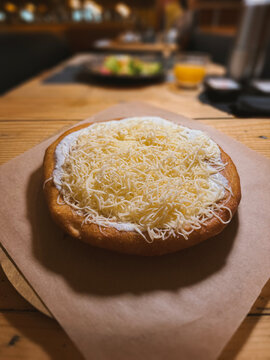 Hungarian langos with cream and cheese, Hungarian dishes, European fast food