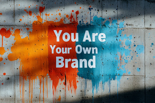 Inspirational "You Are Your Own Brand" Graffiti on a Colorful Wall , Personal Branding.