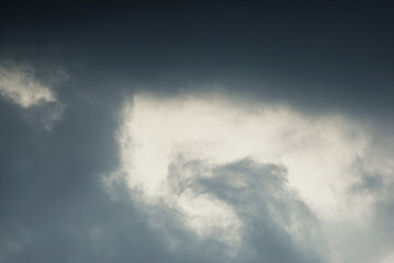 close up of moody clouds turn grey before rain