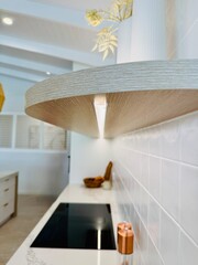 Looking along strip lighting on a beautifully manicured shelf