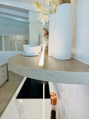 Looking along strip lighting on a beautifully manicured shelf