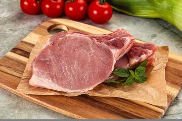 Raw pork steak loin with bone