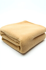 Soft, folded beige fleece blanket. Perfect for cozy comfort on a cold night.