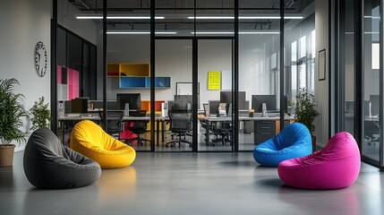 Modern office lounge area with colorful beanbag chairs.