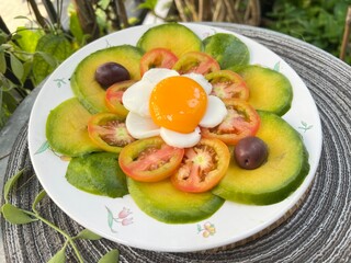 Avocado tomato with yolk and egg white sheet