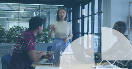 Business data analytics image over diverse team meeting in modern office