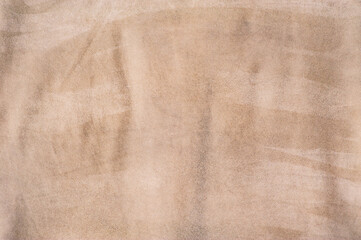 Beige suede background macro photo. Suede leather.