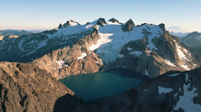 4K Aerial Mountain Peak Summit Glacier Blue Lake Fly Over