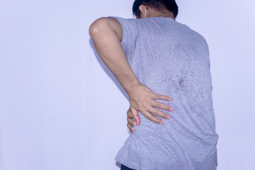 Asian man holding back having symptom pain hurt suffering concept isolated on white