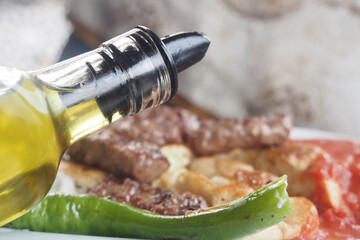 Enjoy grilled meat drizzled with olive oil for added flavor