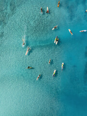 Drone Aerial View of Surfers Riding Waves in Hawaii Sea with Surfboards in the Blue transparent Ocean 