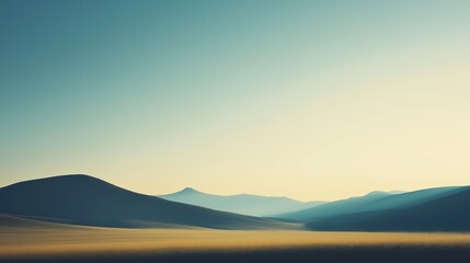 A landscape with mountains in the background and a clear blue sky