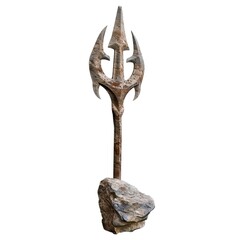 Obraz premium A decorative trident mounted on a rock, possibly used as a prop or display item. isolated on white background