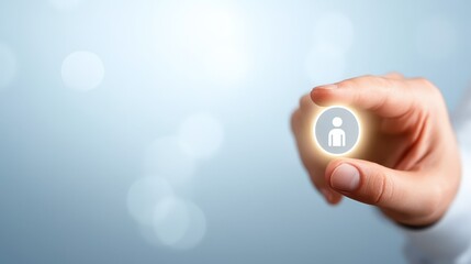 Closeup of hand holding button with person icon, a symbol of digital connection and communication