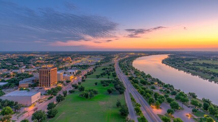 Fototapeta premium Aerial View of Cityscape at Sunset with River