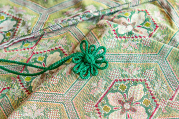 Close-up of kimono and decorative strings