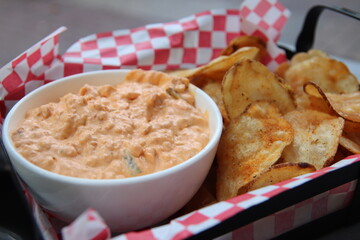 Chips and dip on a plate in a restaurant	