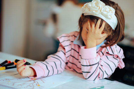 Unhappy Kid Feeling Frustrated with Her Dawning Assignment. Stressed out kid feeling overwhelmed with school tasks 
