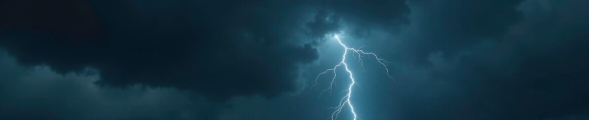 Dark grey clouds gather on a black background, heavy with water and electricity, gloomy, rain