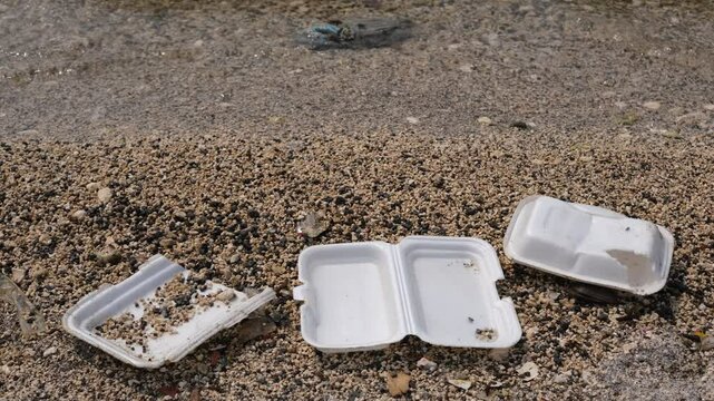 Garbage trash styrofoam being washed to the shore line in Manila Bay, Philippines. 4K footage