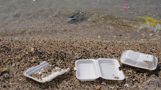 Garbage trash styrofoam being washed to the shore line in Manila Bay, Philippines. 4K footage