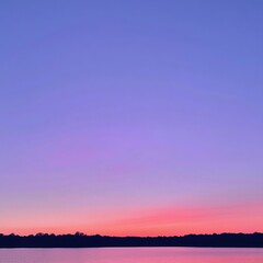 Fototapeta premium Stunning Sunset Gradient over Tranquil Lake with Silhouetted Forest