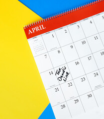 Tax deadline marked on a calendar for April with colorful background