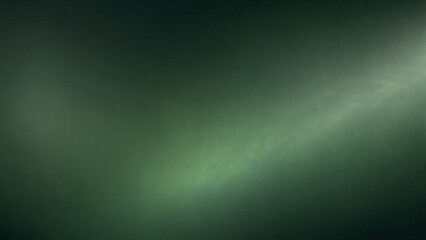 Fototapeta premium abstract blurred green background with a gradient shadows and light rays