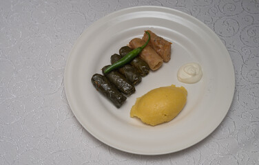 Stuffed Grape Leaves hot peppers and sour cream at wedding , Vrancea, Romania, 2024