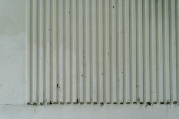 Obraz premium Architectural elements like walls and fences with diverse designs defining exterior and interior spaces.