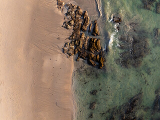 Aerial view of coastal rocks on a sand beach in Koh Lanta Island, Thailanddefault