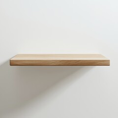 Simple wooden shelf against a white wall.